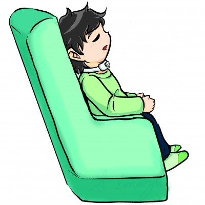 緑の椅子に座っている子ども